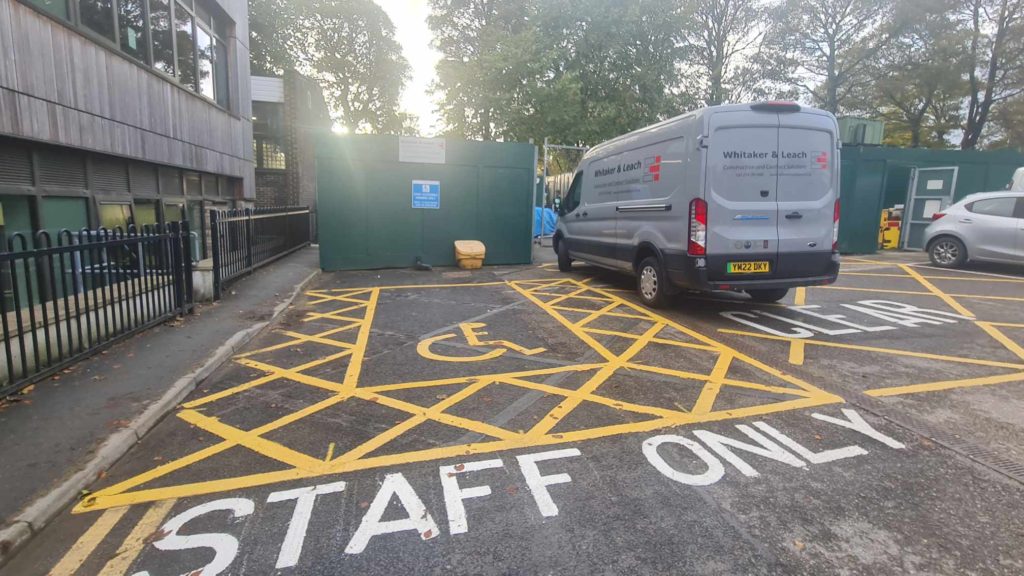 The photo shows accessible parking bay freshly painted for Rados next to the building where he works.